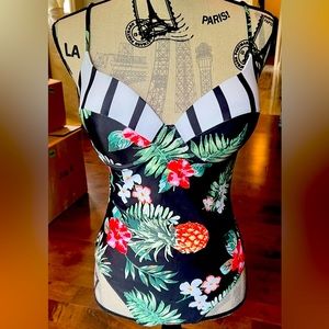Ladies one piece tropical bathing suit.